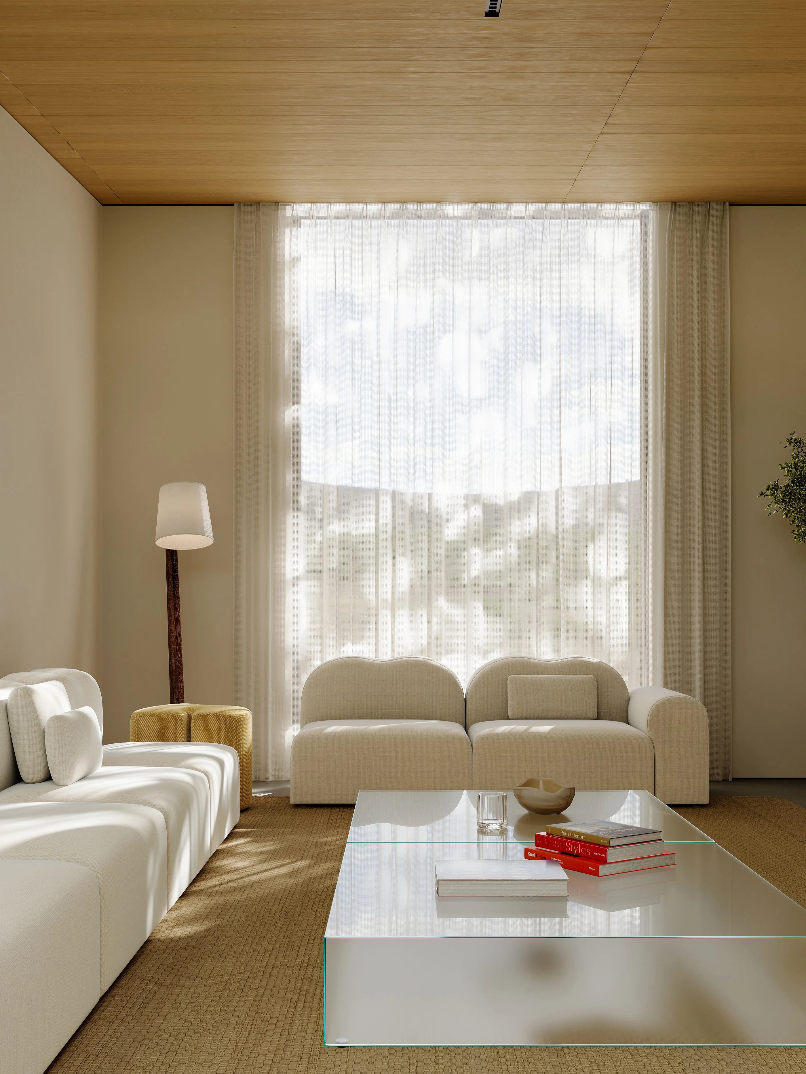 Modern living room with beige sofa, glass coffee table, and large window.