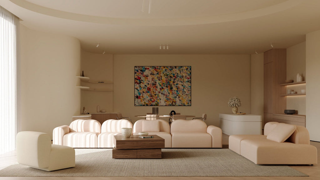 Modern living room with beige furniture and colorful artwork.