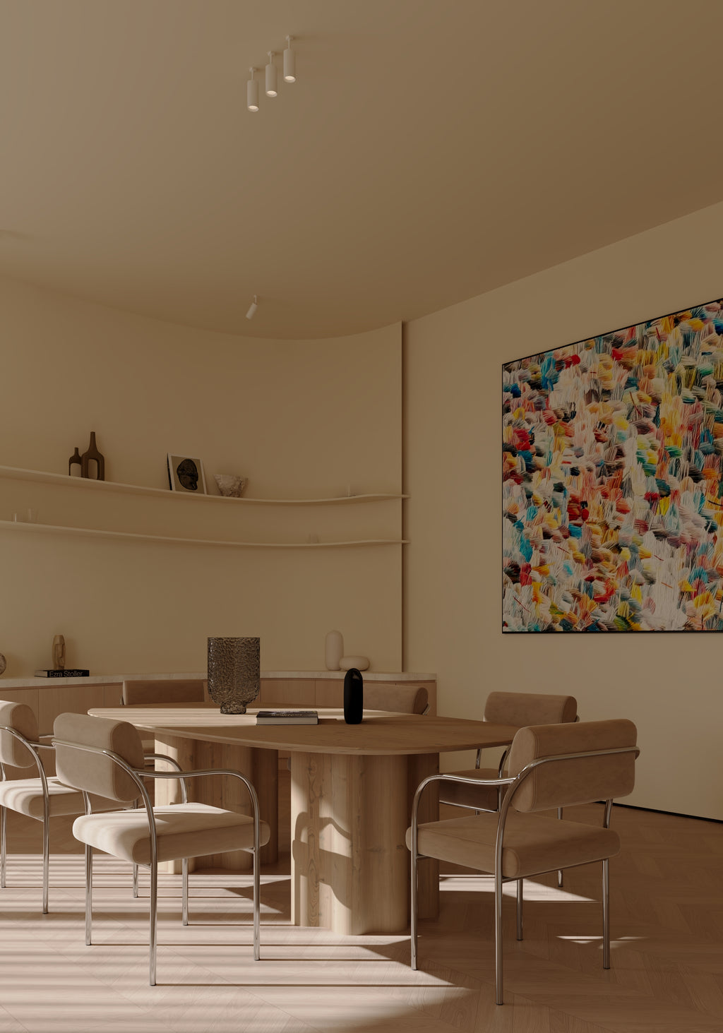 Modern dining room with a round table and chairs, neutral tones, and a colorful abstract painting on the wall.