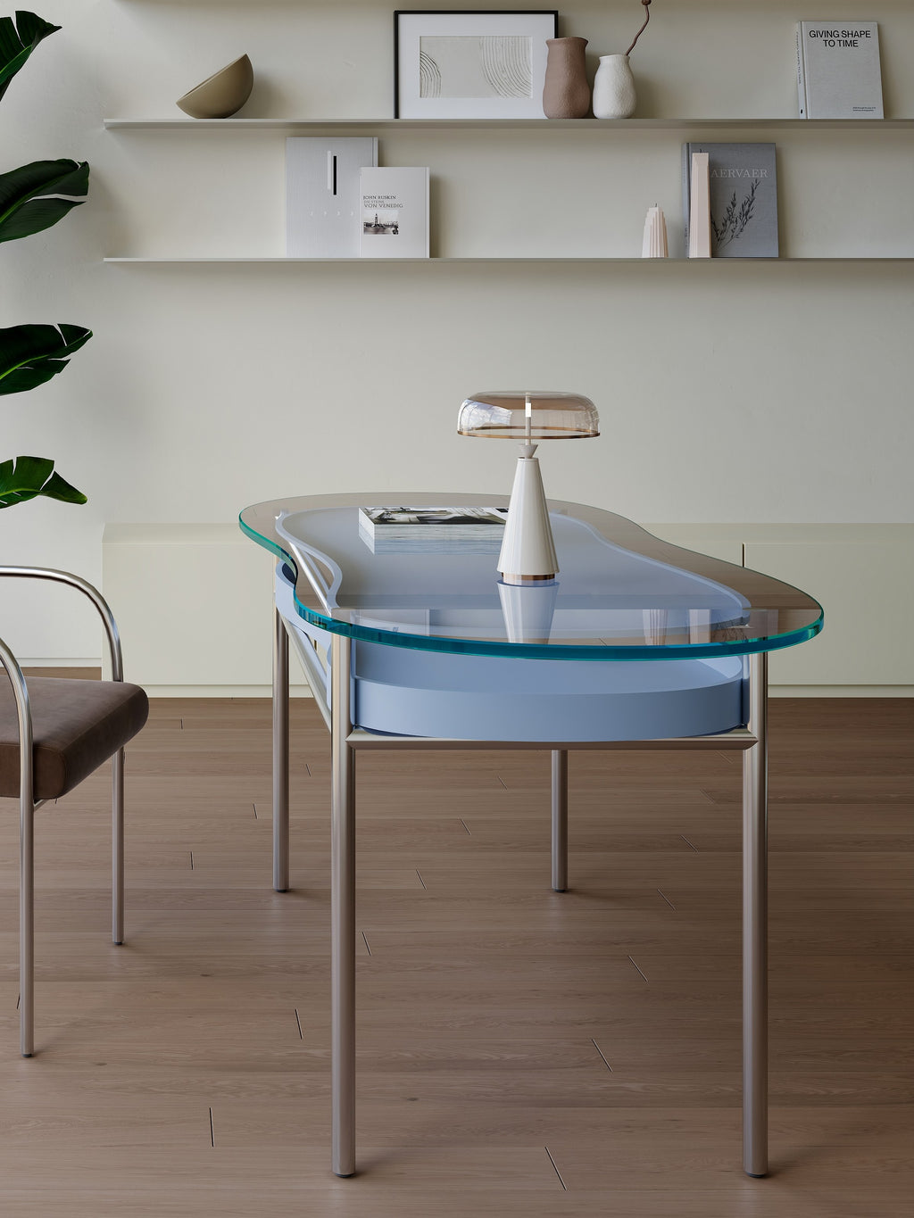Glass dining table with a modern lamp in a minimalistic room.