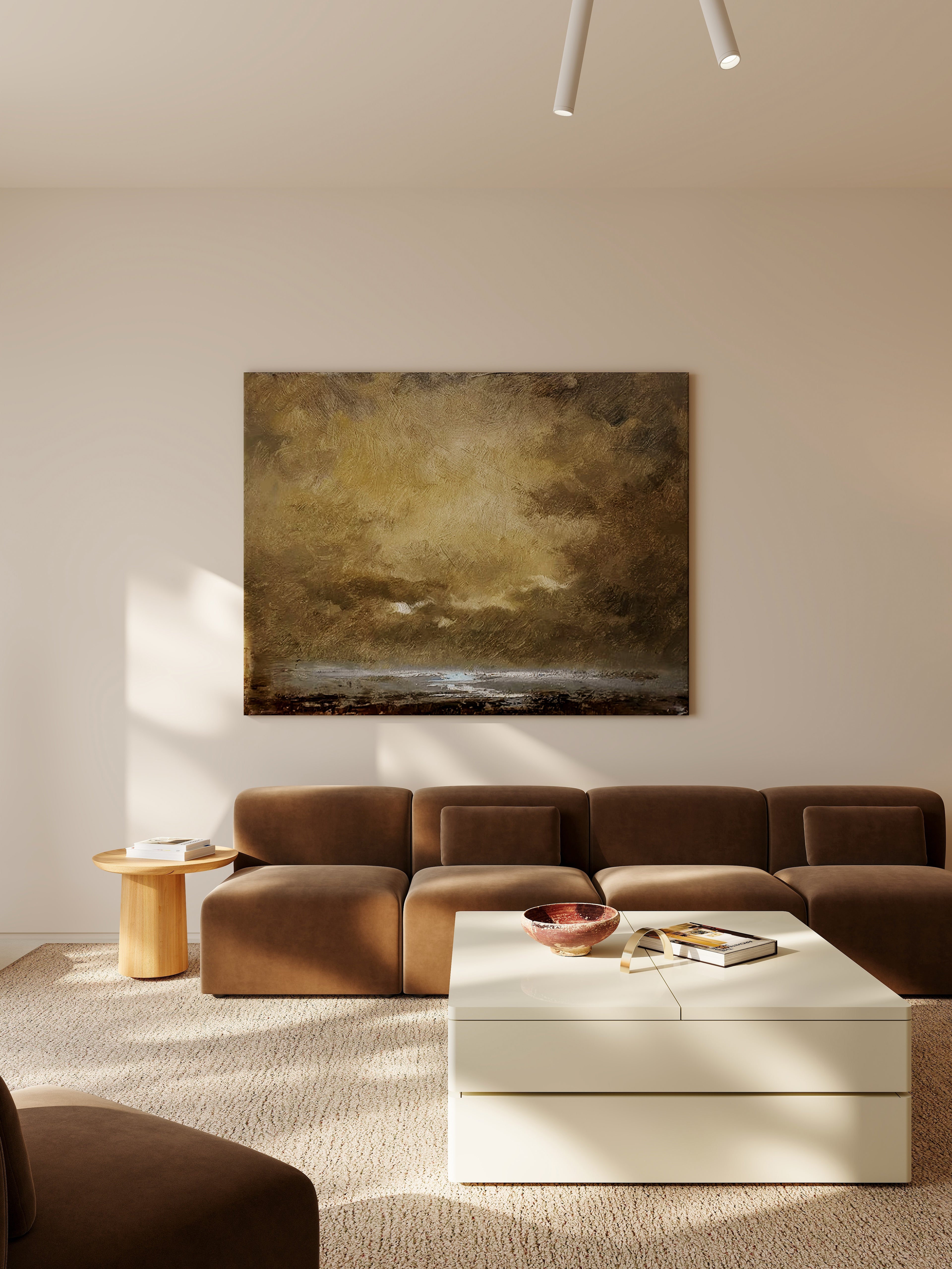Modern living room with a brown sectional sofa, white coffee table, and abstract painting on the wall.