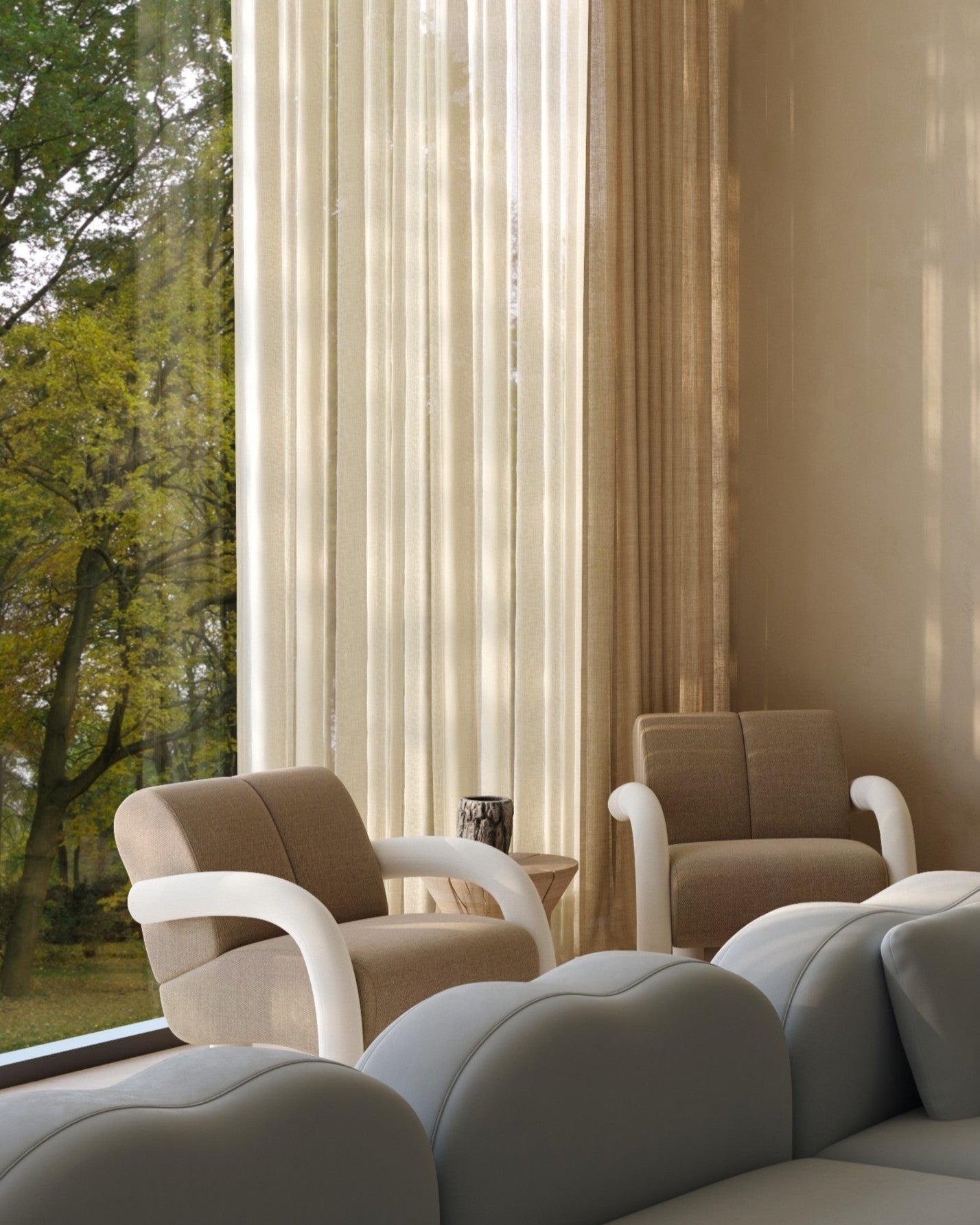 Modern living room with beige armchair, gray sofa, and large windows with curtains.